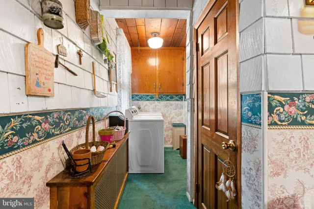 a bathroom with a tub sink and window