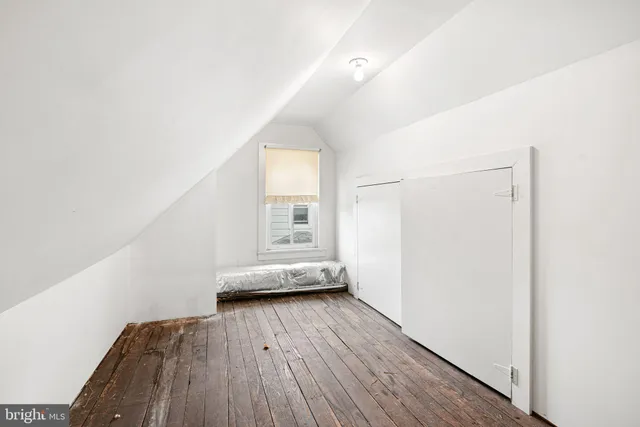 a room with pool table and windows