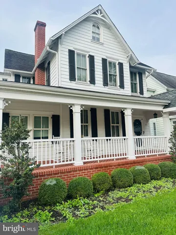 a front view of a house with a porch