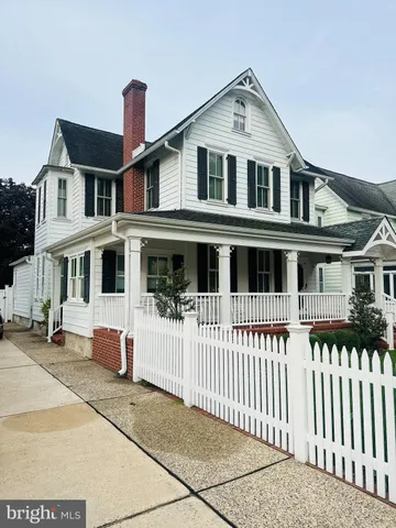 a front view of a house with a porch
