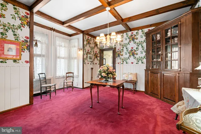 a view of a livingroom with furniture a table and chair