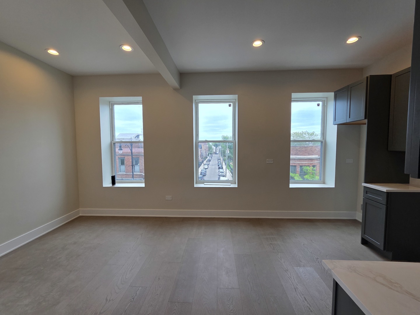 3216 South Morgan Street, Unit 2F Chicago, IL 60608 - Photo 3 of 9 a view of room with window and wooden floor