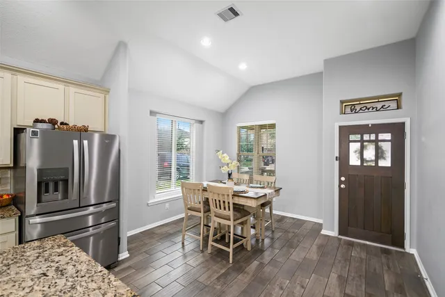 a dining room with furniture and window