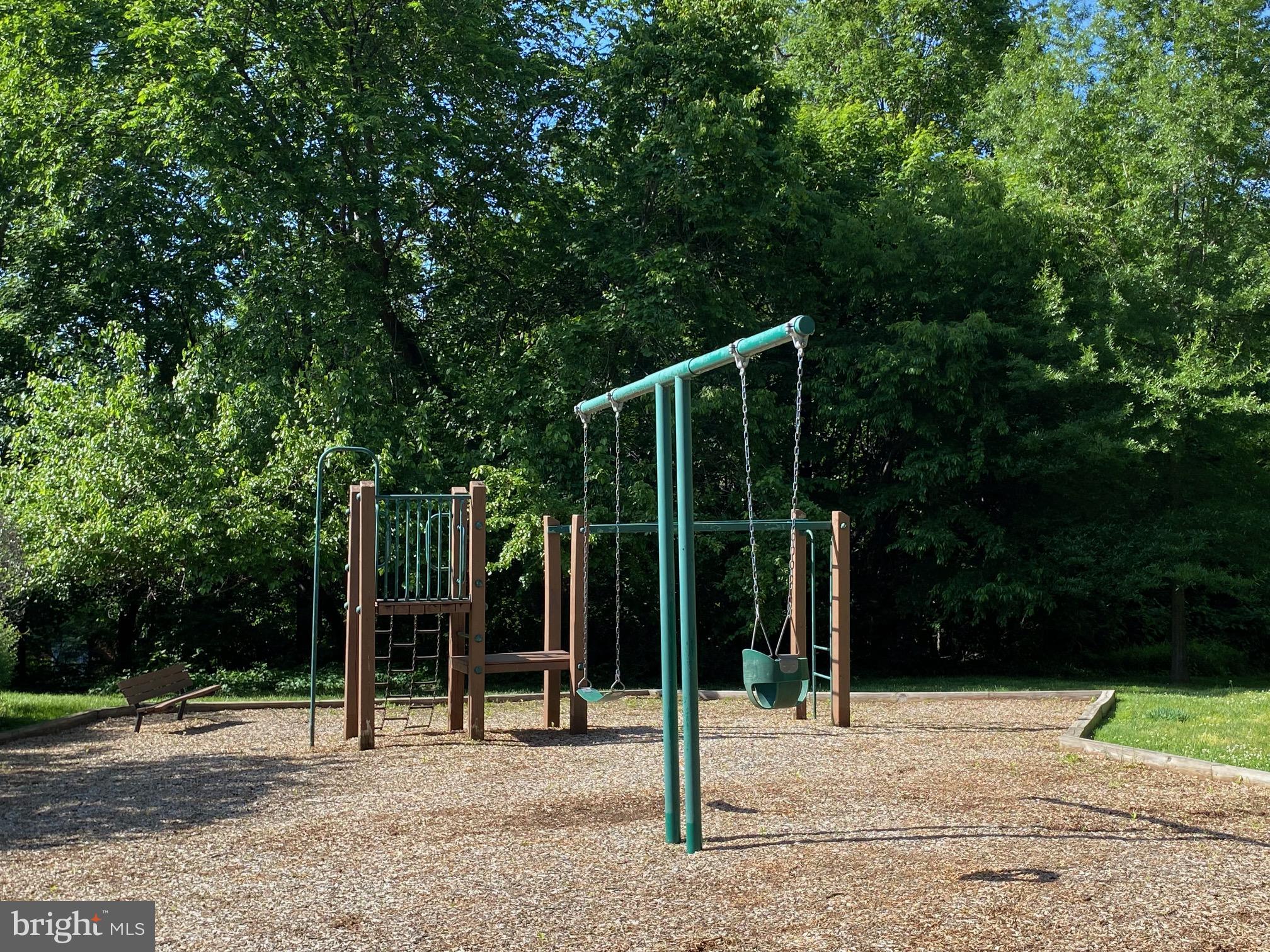 3706 Gunston Road Alexandria, VA 22302 - Photo 23 of 32 Sunny playground amidst lush greenery.