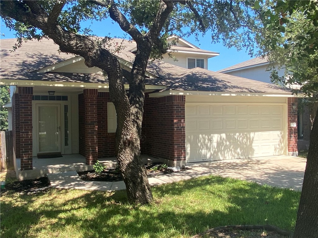 1130 Sundrop Place Round Rock, TX 78665 - Photo 1 of 1 a front view of house with yard