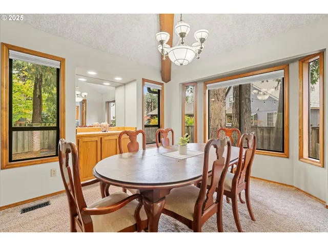 a view of a dining room with furniture window and outside view