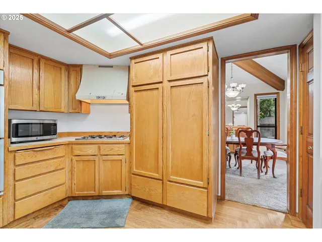 a kitchen with stainless steel appliances granite countertop a refrigerator and cabinets