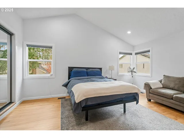 a bedroom with a bed and a couch