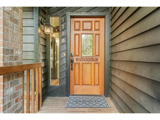 a view of a door and wooden floor