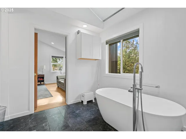 a bathroom with a toilet sink and tub