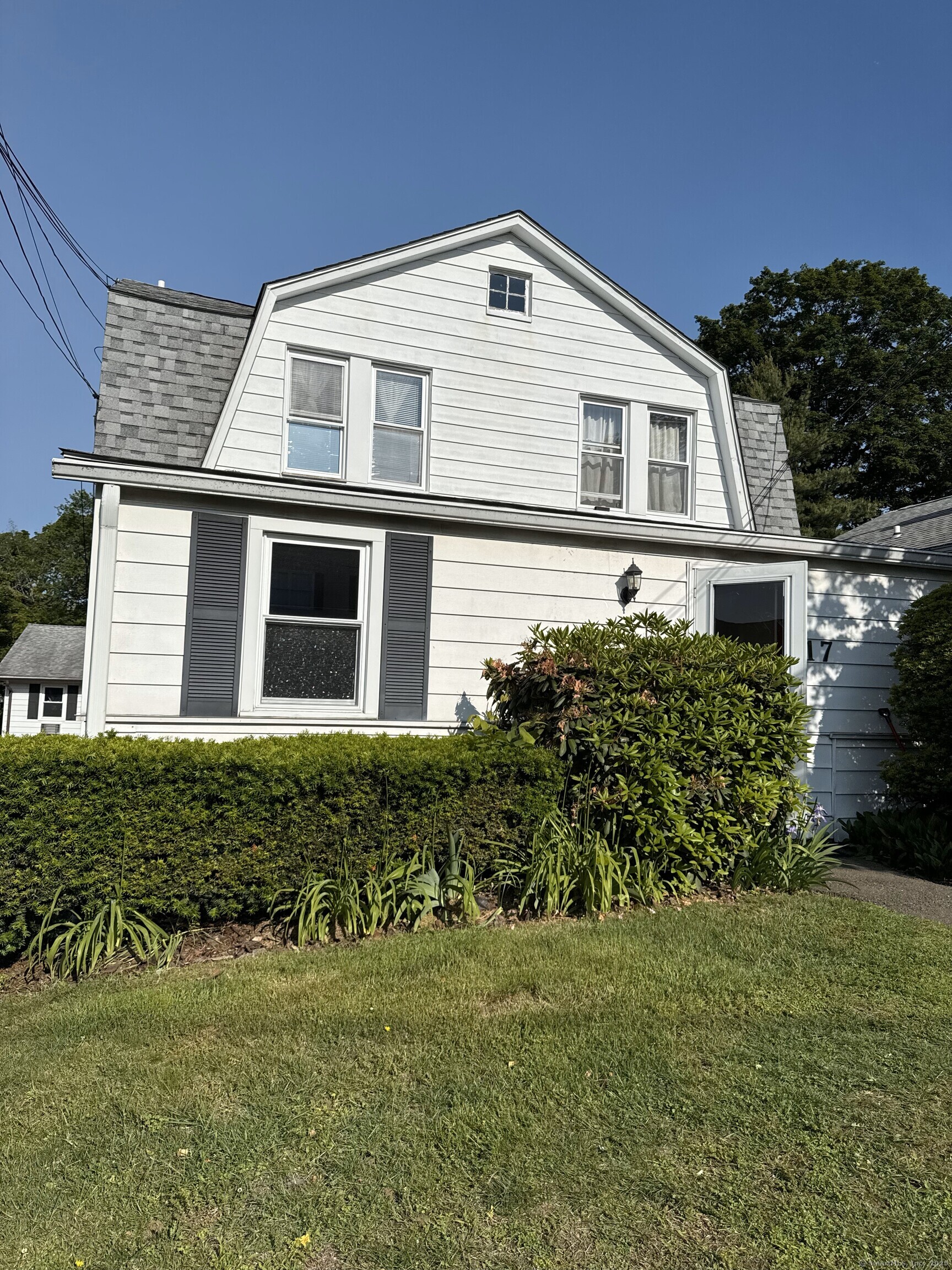 17 Duncanson Street, Unit 2 Stamford, CT 06905 - Photo 1 of 1 a front view of a house with a garden
