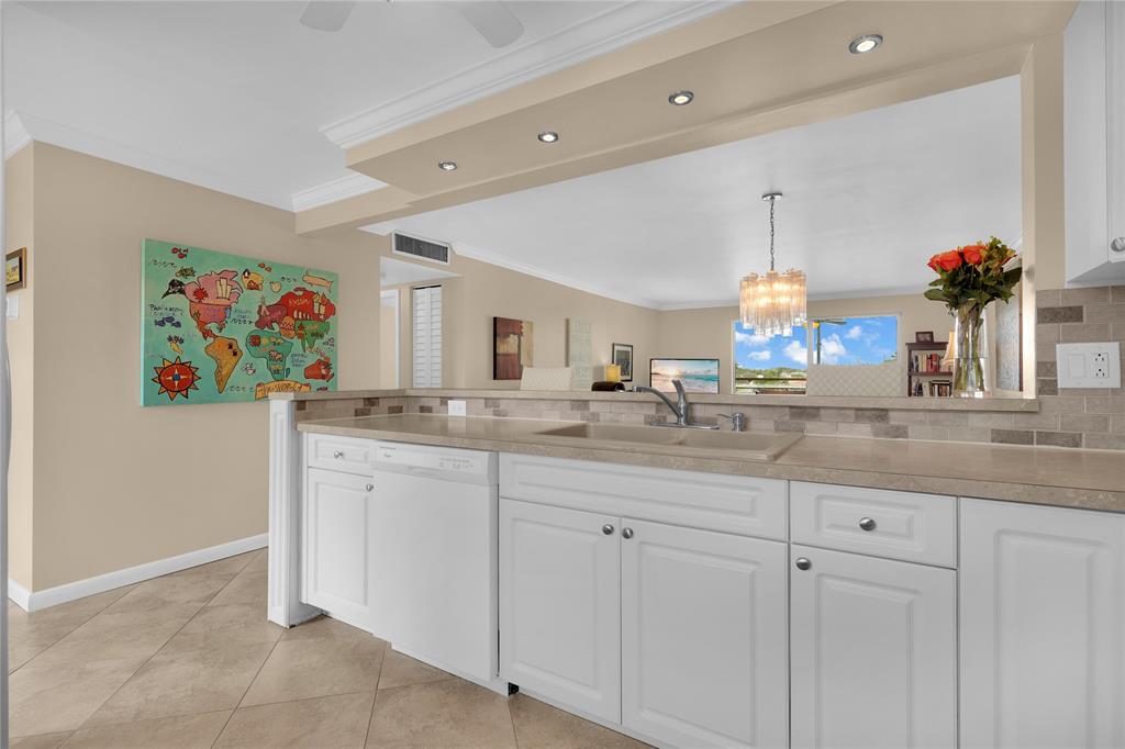 321 Southeast 3rd Street, Unit 307 Dania Beach, FL 33004 - Photo 5 of 21 a spacious bathroom with a sink a mirror and a shower