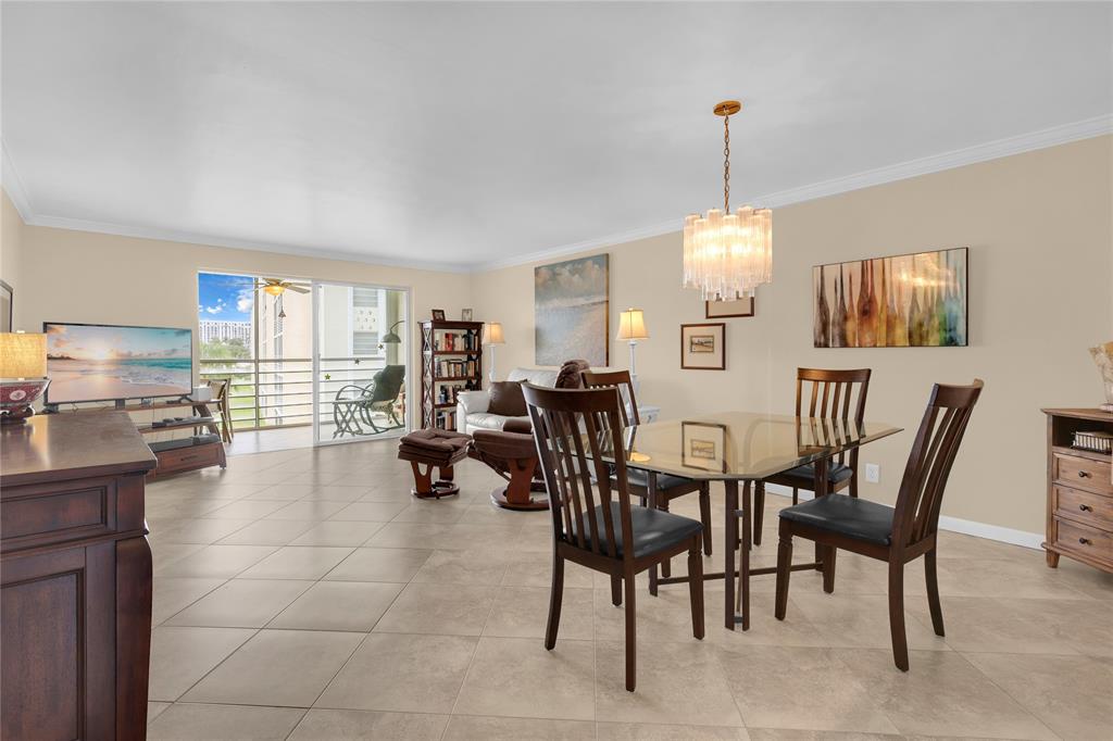 321 Southeast 3rd Street, Unit 307 Dania Beach, FL 33004 - Photo 6 of 21 a view of a dining room with furniture