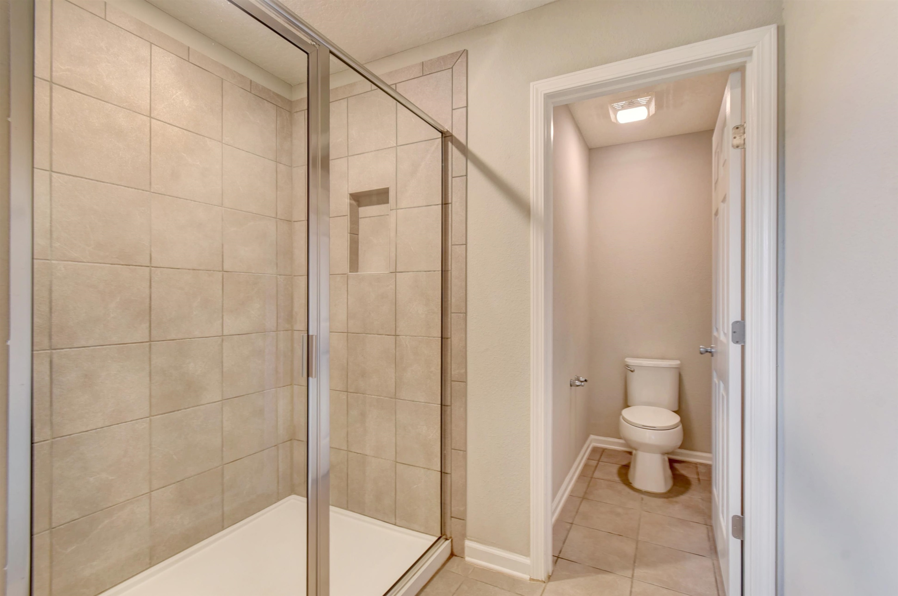 9 Bella Vita Way Ormond Beach, FL 32174 - Photo 18 of 36 a bathroom with a toilet and a shower