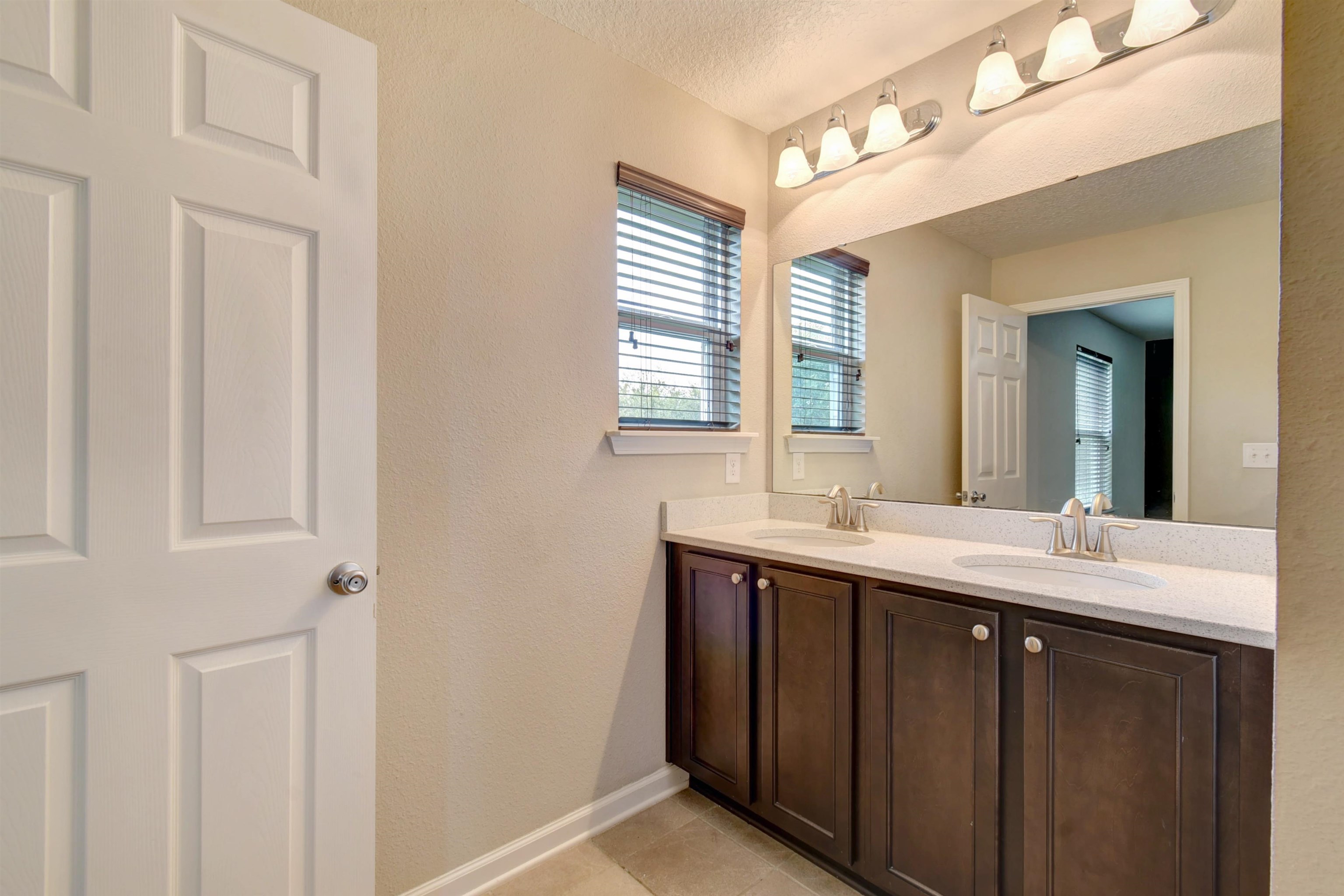 9 Bella Vita Way Ormond Beach, FL 32174 - Photo 20 of 36 a kitchen with a sink and a mirror