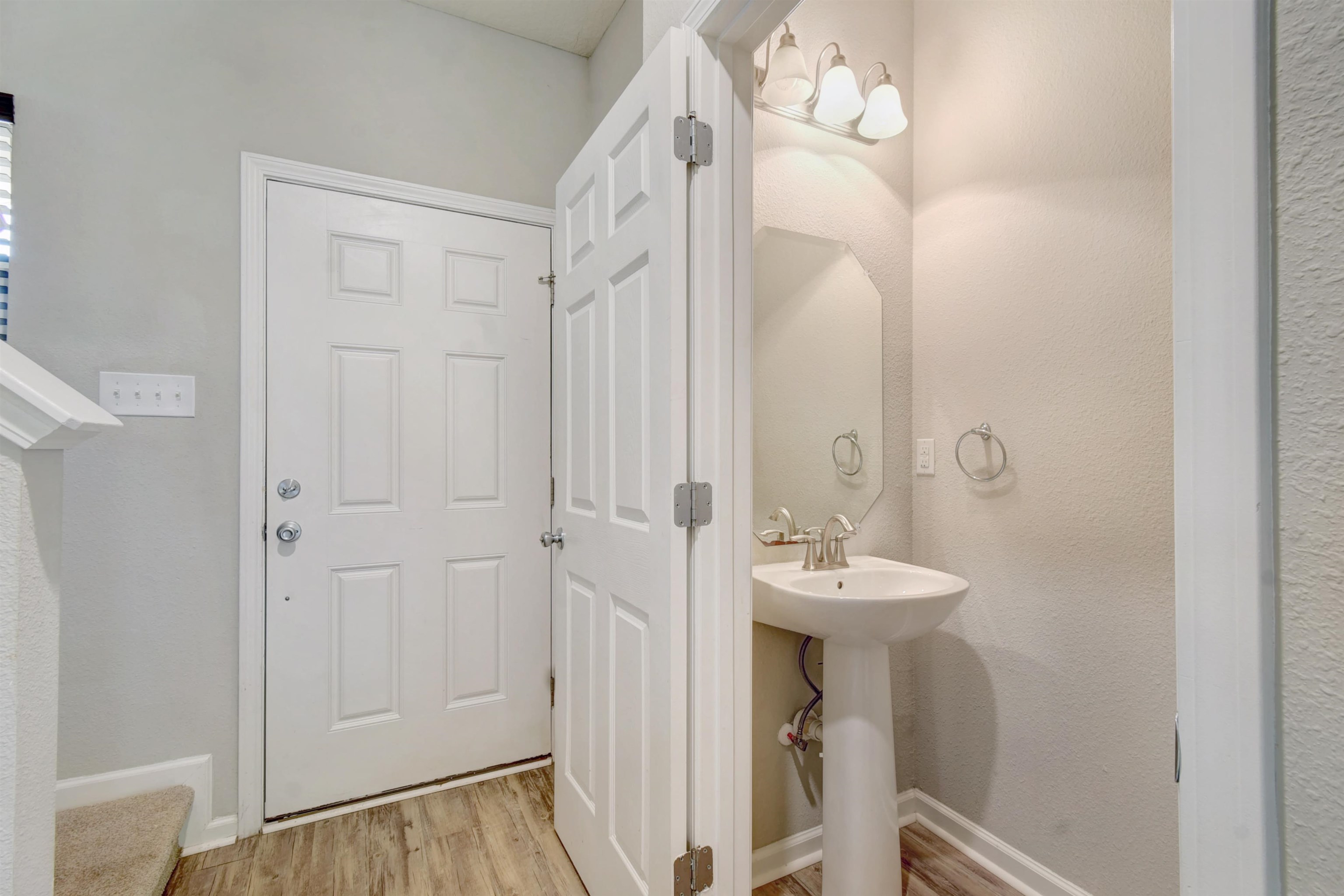 9 Bella Vita Way Ormond Beach, FL 32174 - Photo 23 of 36 a bathroom with a sink a mirror and a shower