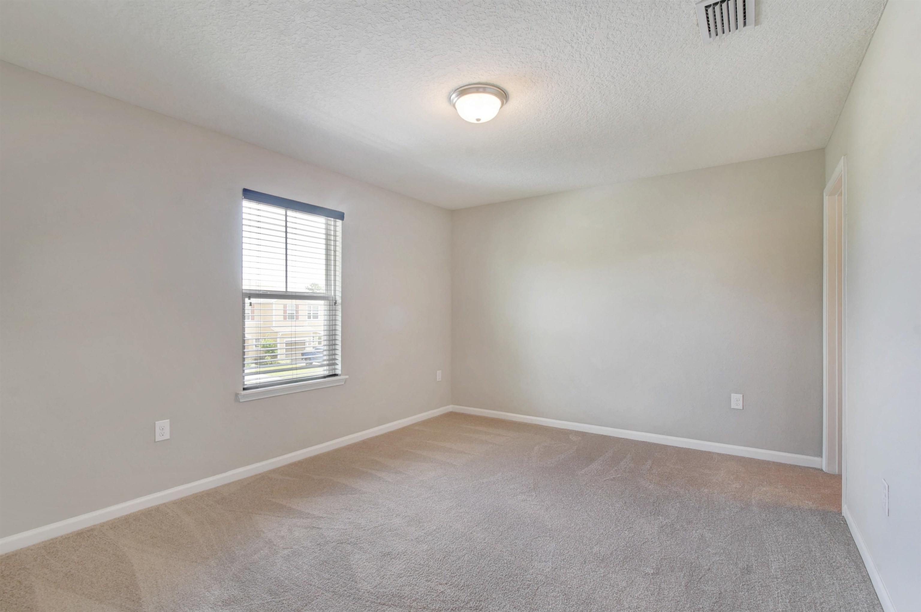 9 Bella Vita Way Ormond Beach, FL 32174 - Photo 24 of 36 an empty room with a window