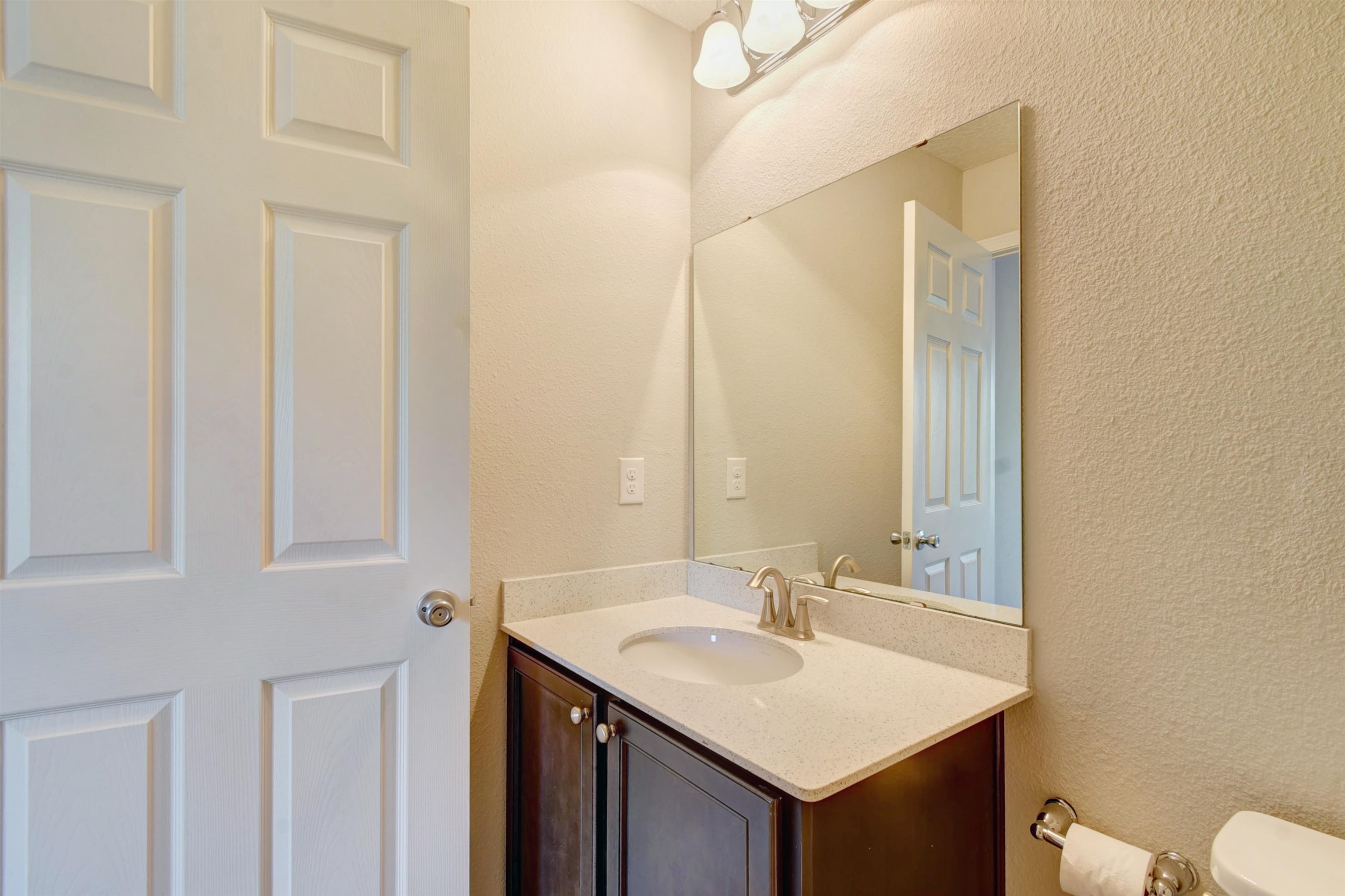 9 Bella Vita Way Ormond Beach, FL 32174 - Photo 28 of 36 a bathroom with a sink and a mirror