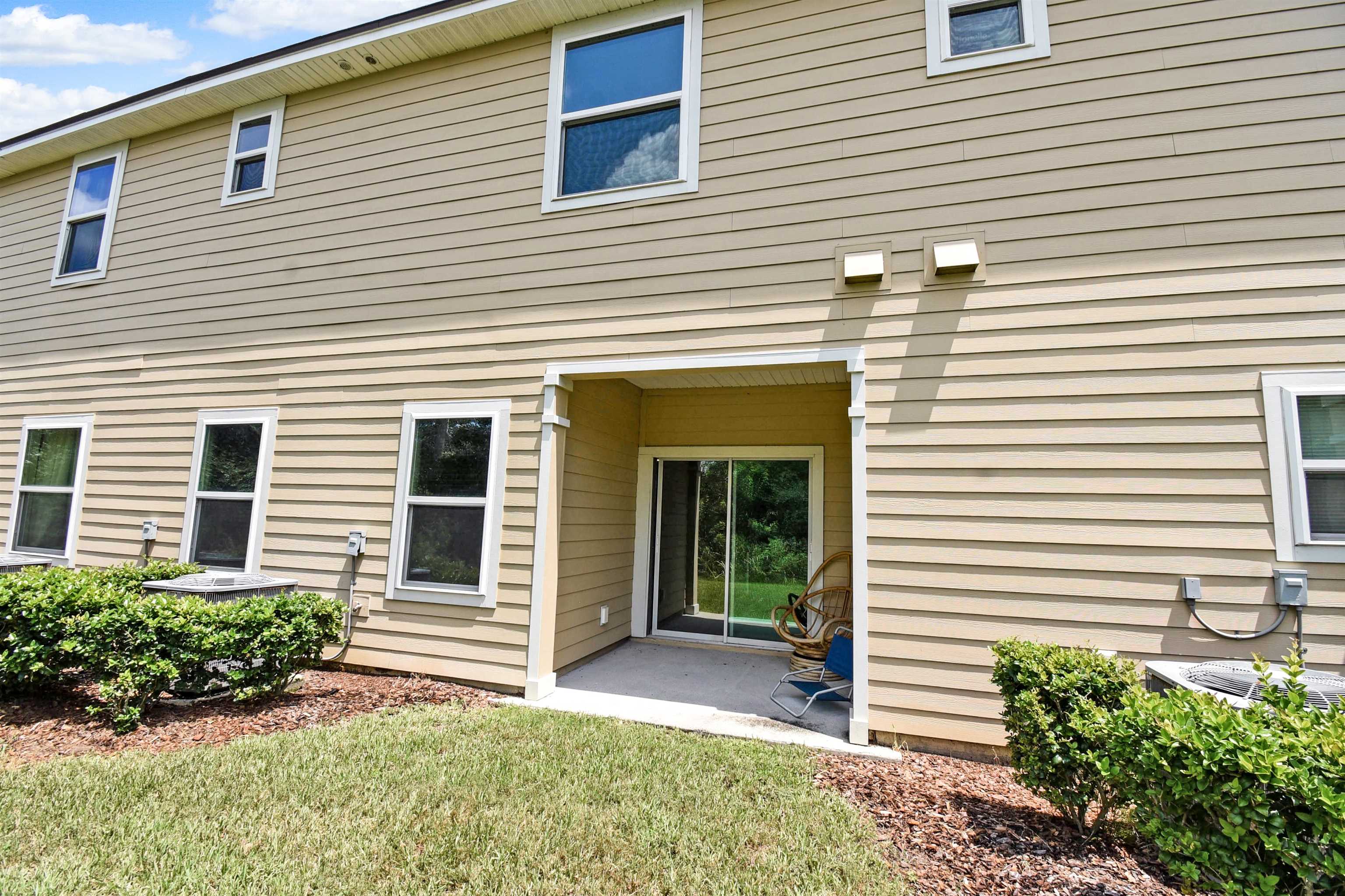 9 Bella Vita Way Ormond Beach, FL 32174 - Photo 36 of 36 a view of a house with a yard and a garage