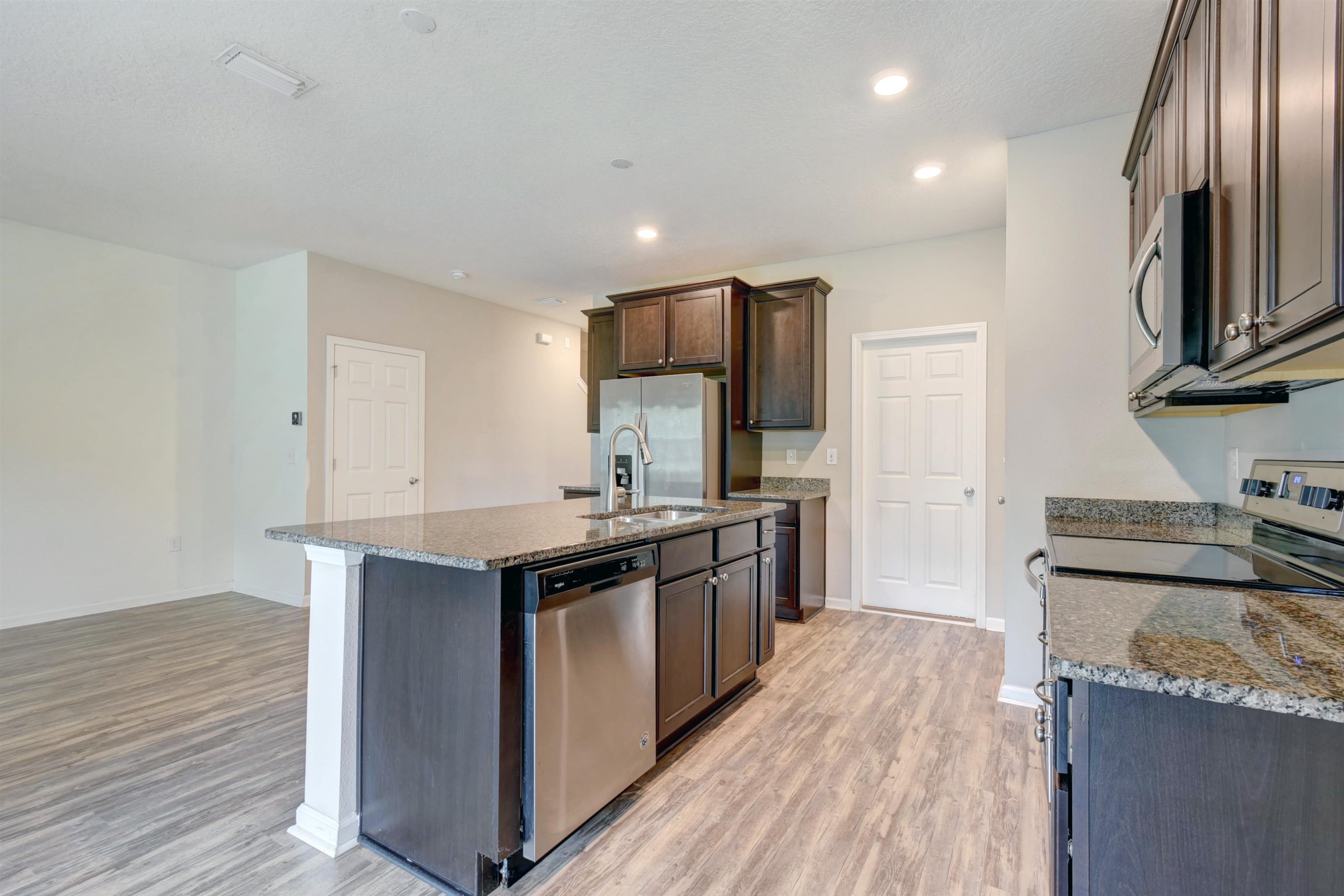 9 Bella Vita Way Ormond Beach, FL 32174 - Photo 7 of 36 a kitchen with stainless steel appliances granite countertop a stove and a sink
