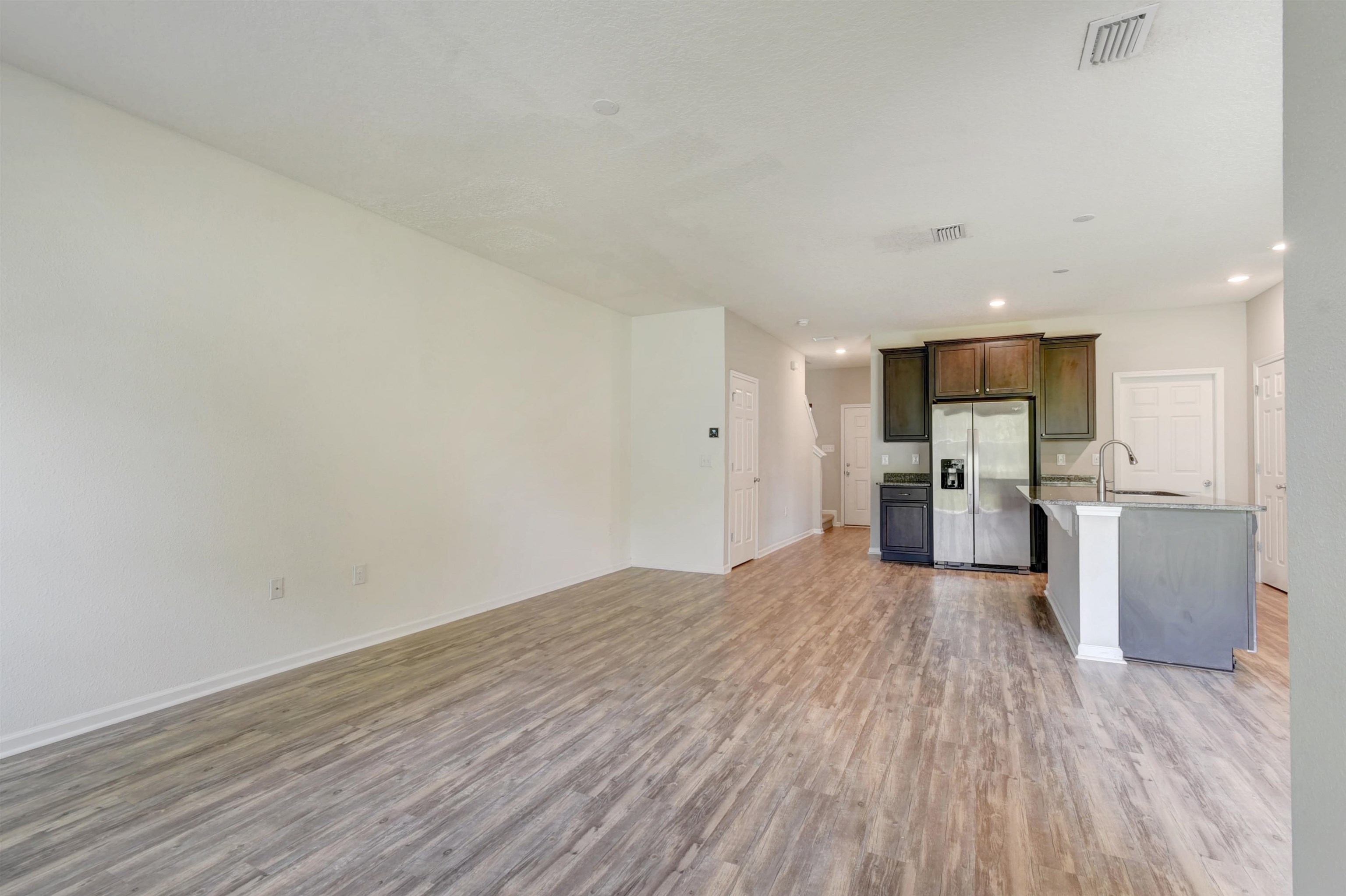9 Bella Vita Way Ormond Beach, FL 32174 - Photo 9 of 36 a view of kitchen with wooden floor