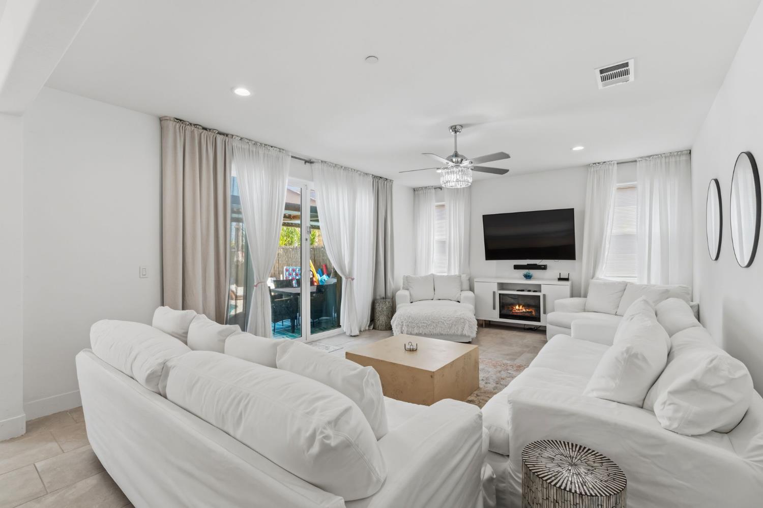 6326 West Richert Avenue Fresno, CA 93723 - Photo 13 of 45 a living room with furniture and a flat screen tv