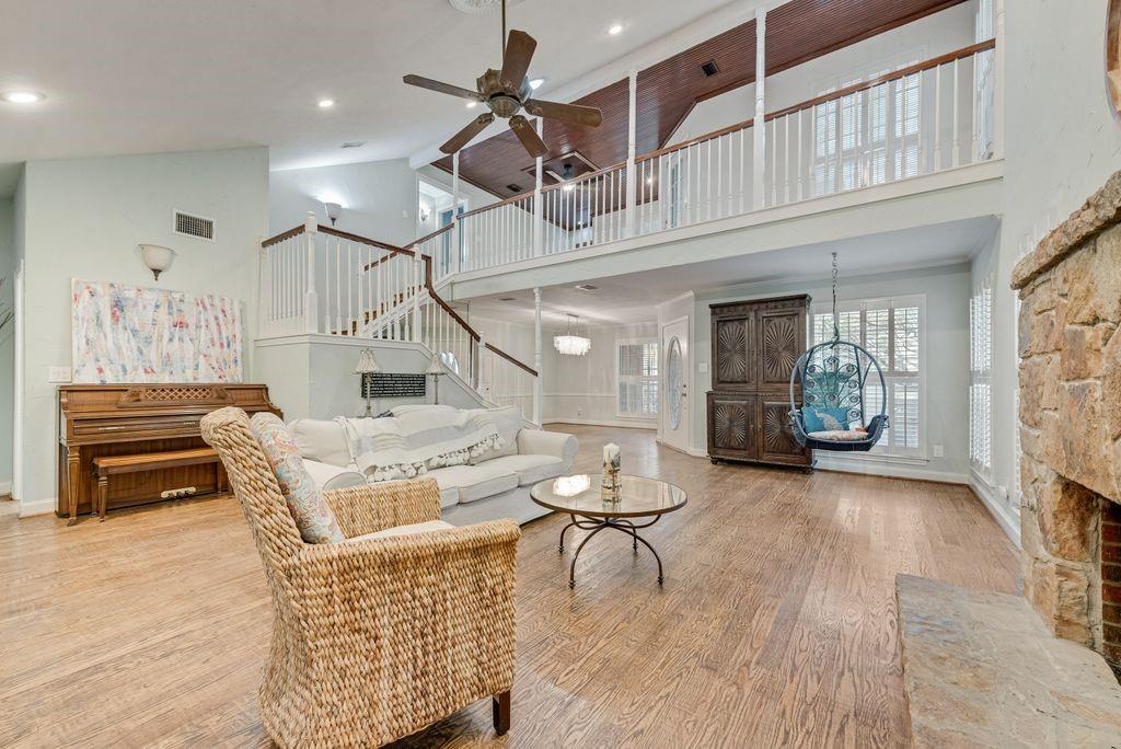 2 Eastshore Road Heath, TX 75032 - Photo 5 of 30 a living room with furniture and a wooden floor
