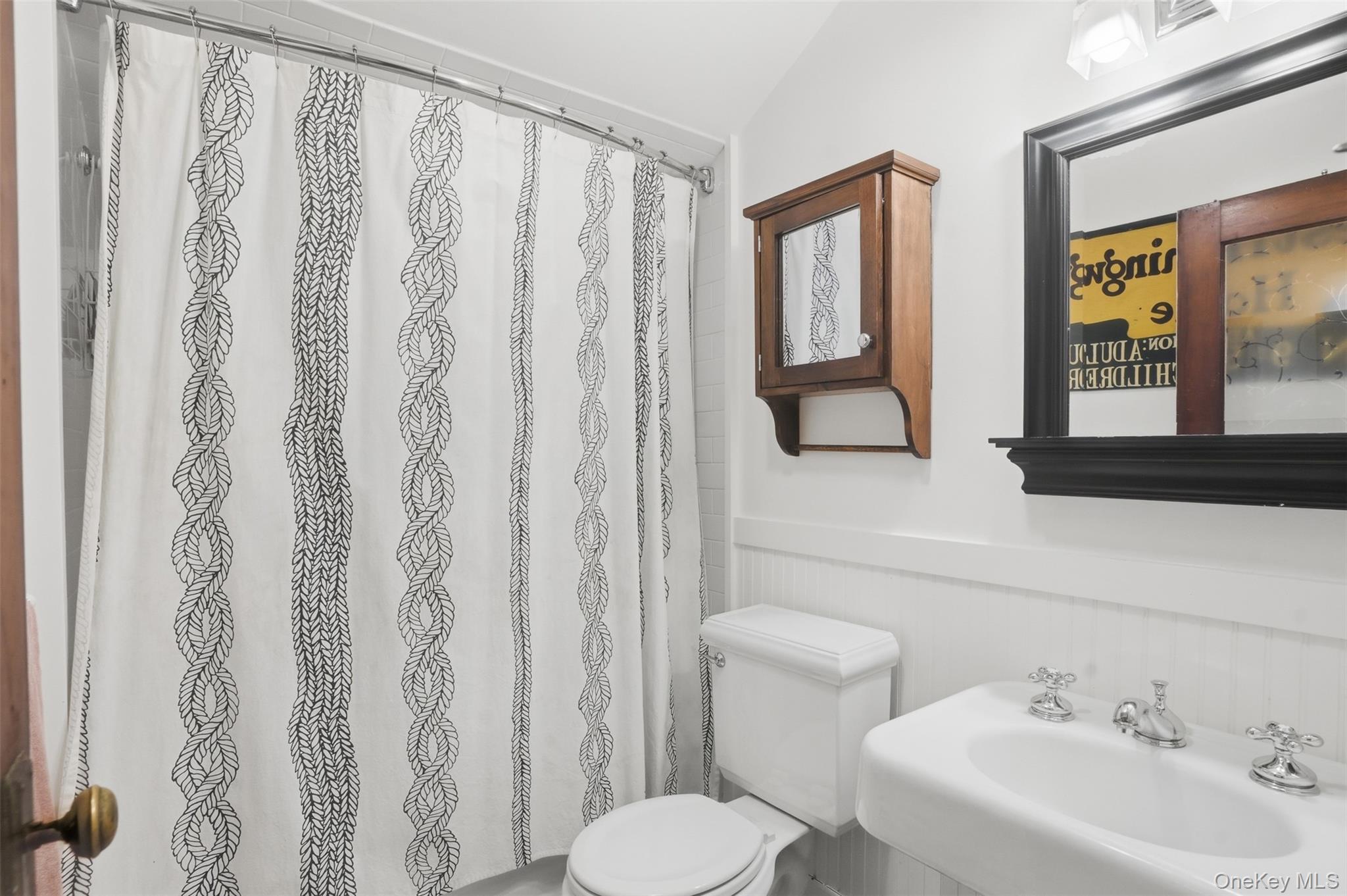 726 Wittenberg Road Mount Tremper, NY 12457 - Photo 25 of 32 a bathroom with a toilet sink and mirror