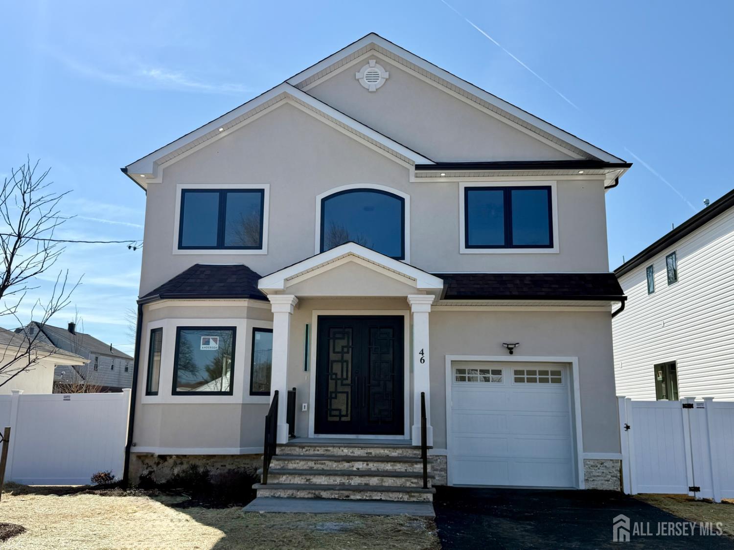 a front view of a house with garage