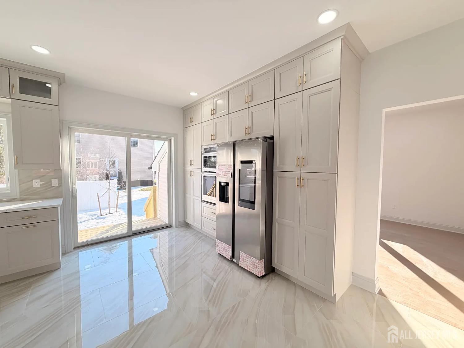 46 Foyer Street Edison, NJ 08817 - Photo 4 of 12 a view of an empty room with a window