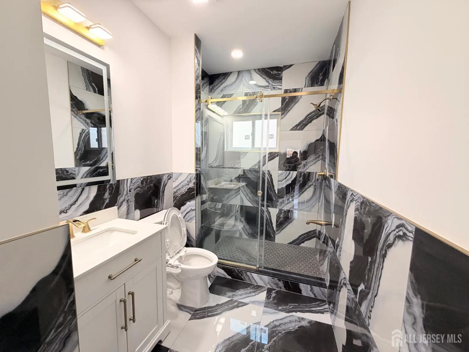 46 Foyer Street Edison, NJ 08817 - Photo 7 of 12 a bathroom with a sink toilet and shower