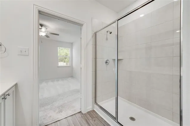 a bathroom with a glass shower door