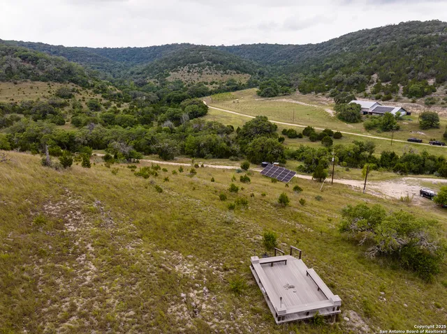 a view of a town with mountains in the background