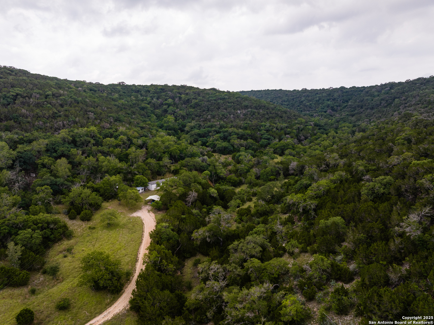 1600 Mickle Creek Road Medina, TX 78055 - Photo 16 of 18 an aerial view of residential houses with outdoor space and trees