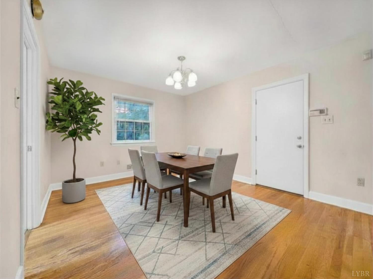 2044 Indian Hill Road Lynchburg, VA 24503 - Photo 13 of 30 a view of a dining room with furniture and wooden floor