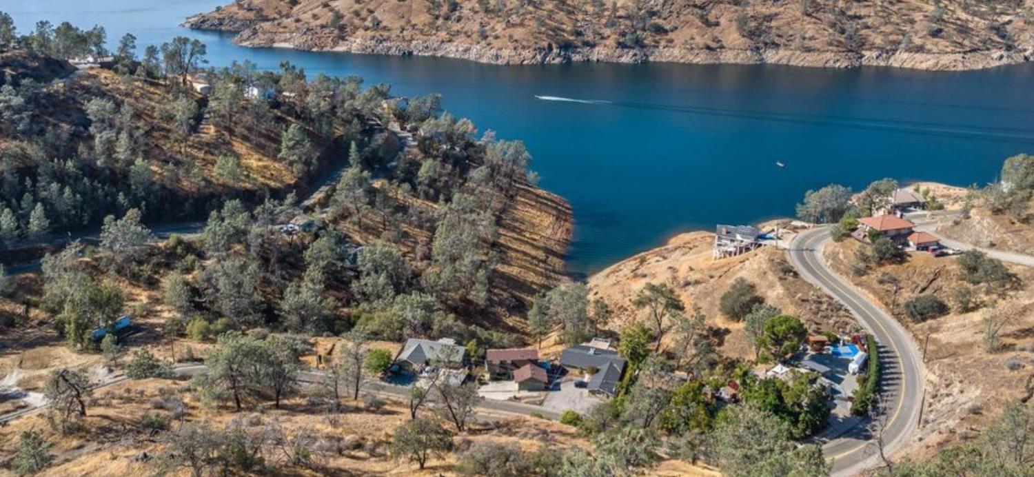 27817 Sky Harbour Road Friant, CA 93626 - Photo 24 of 36 a view of a lake with a house