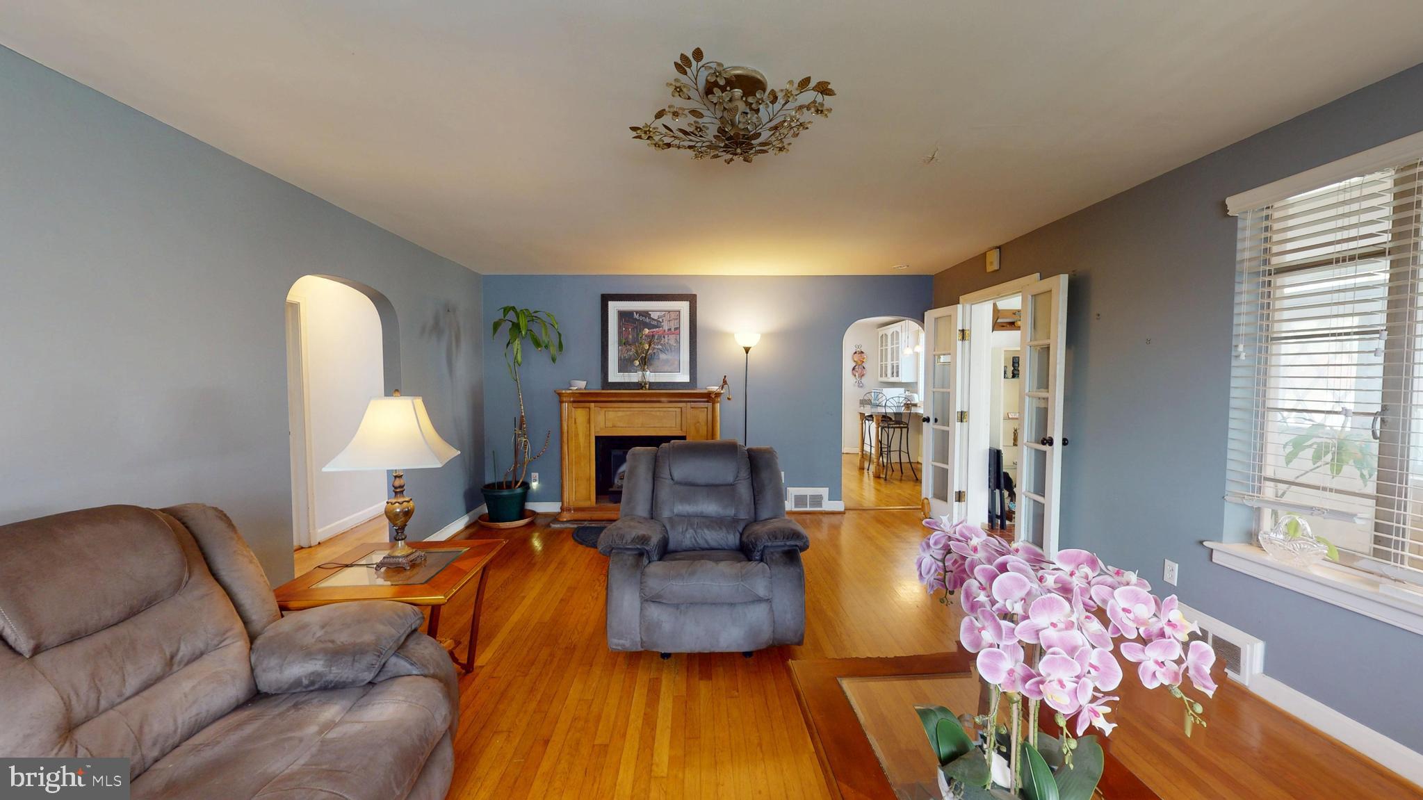 6103 Manor Road Clinton, MD 20735 - Photo 11 of 48 a living room with furniture and a fireplace