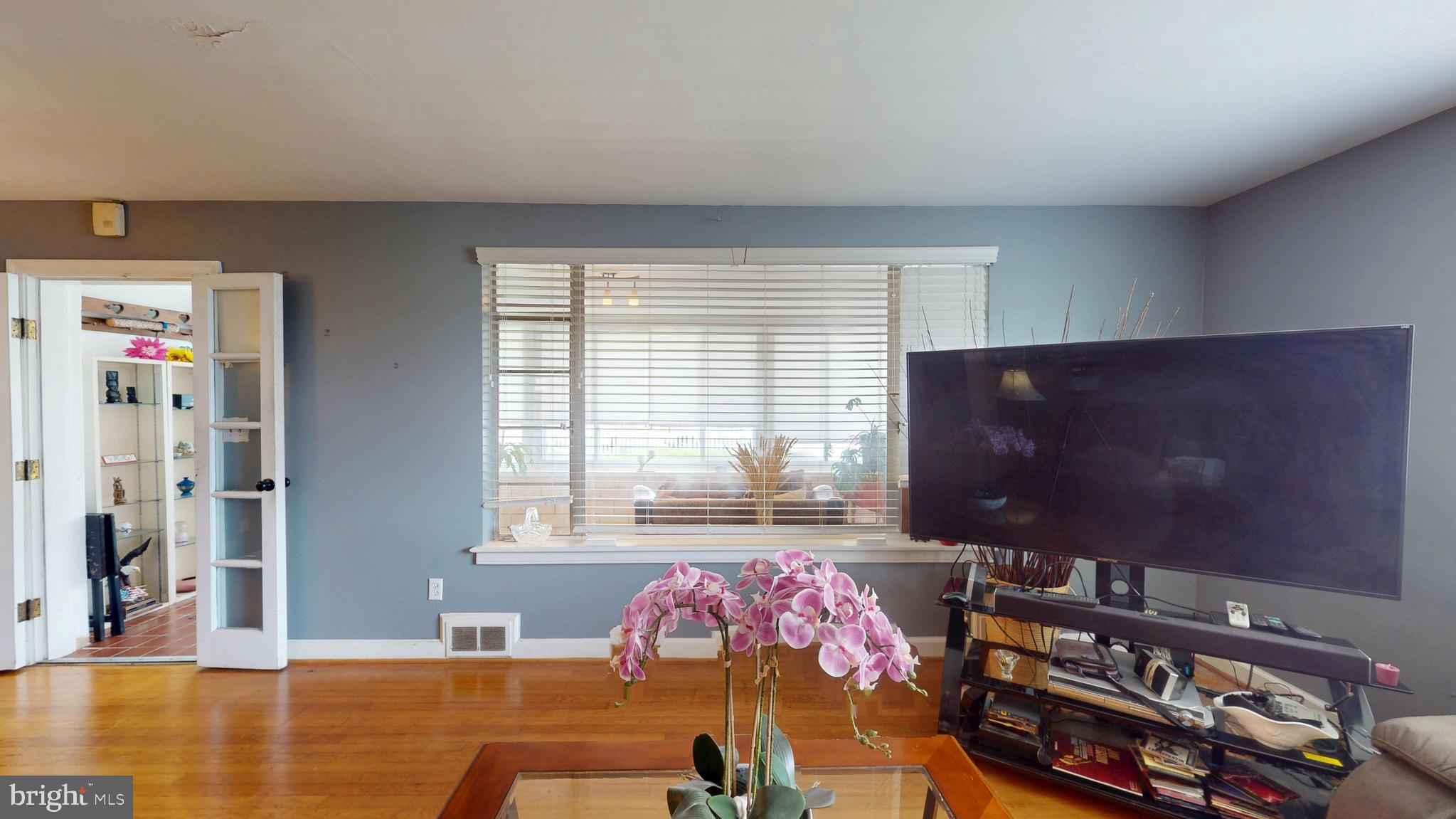 6103 Manor Road Clinton, MD 20735 - Photo 12 of 48 a living room with furniture and a flat screen tv