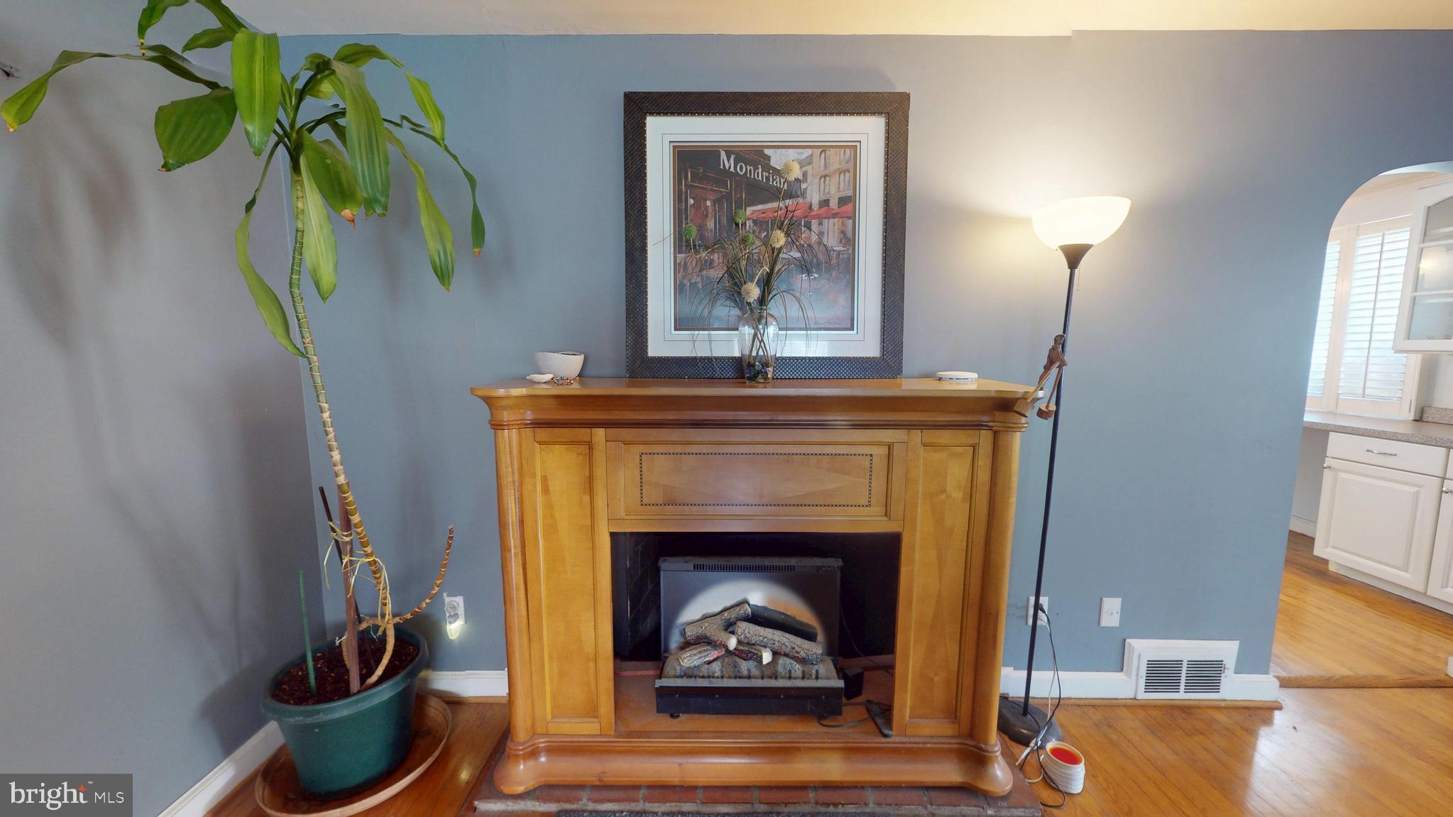 6103 Manor Road Clinton, MD 20735 - Photo 15 of 48 a living room with furniture and a fireplace