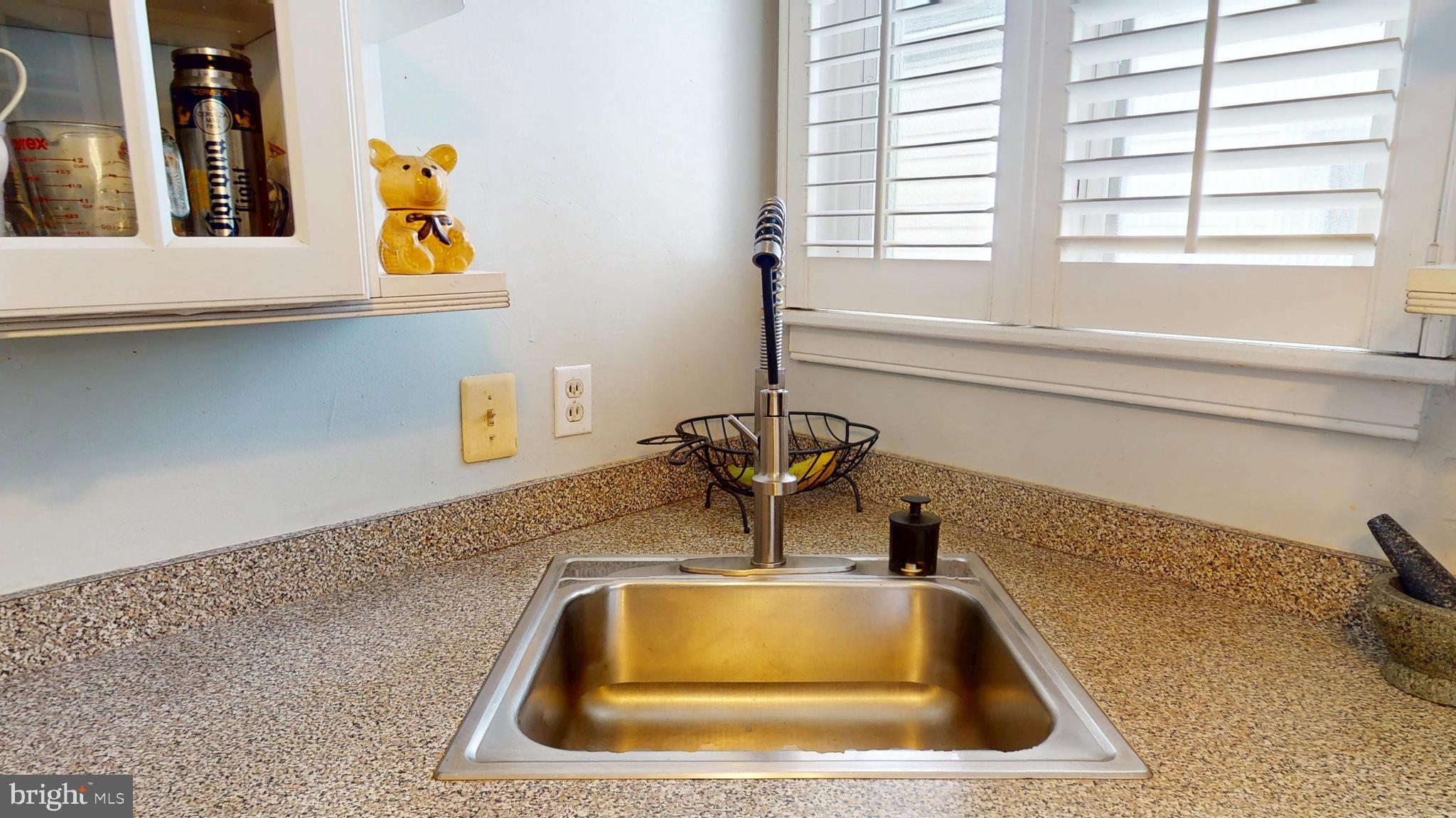 6103 Manor Road Clinton, MD 20735 - Photo 22 of 48 a bathroom with a sink and a window