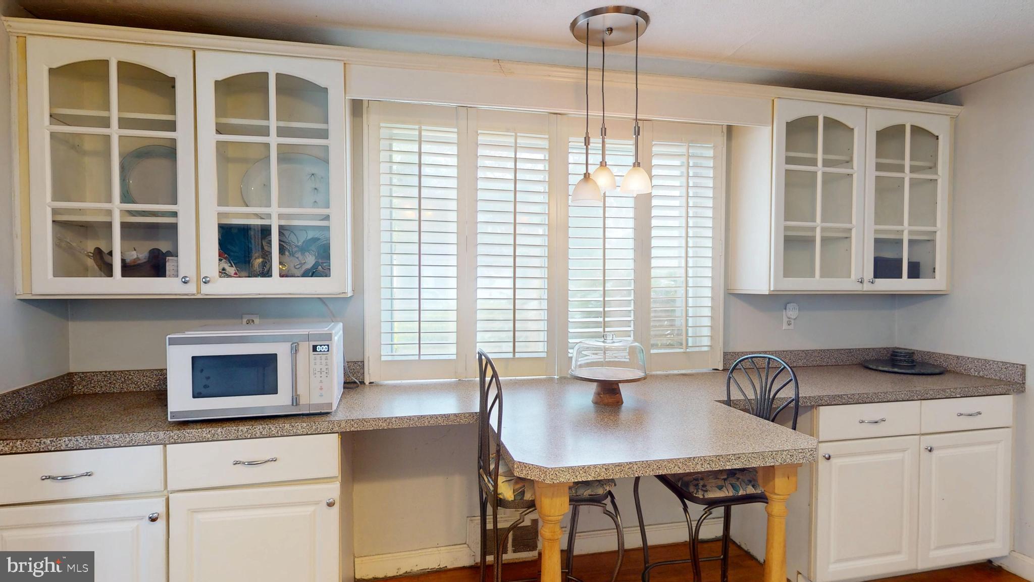 6103 Manor Road Clinton, MD 20735 - Photo 24 of 48 a kitchen with granite countertop a stove a sink and a granite counter tops