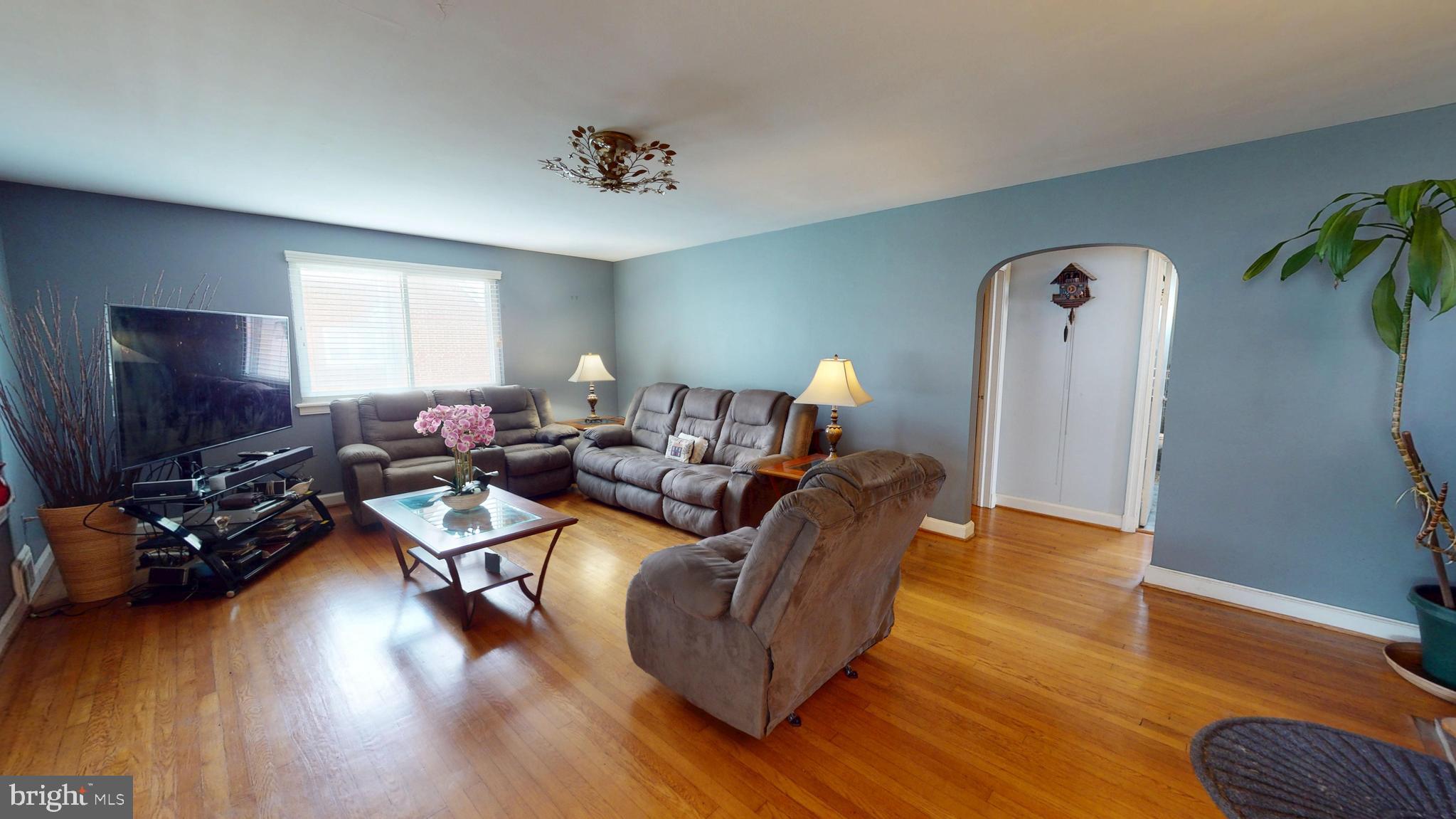 6103 Manor Road Clinton, MD 20735 - Photo 26 of 48 a living room with furniture and a flat screen tv