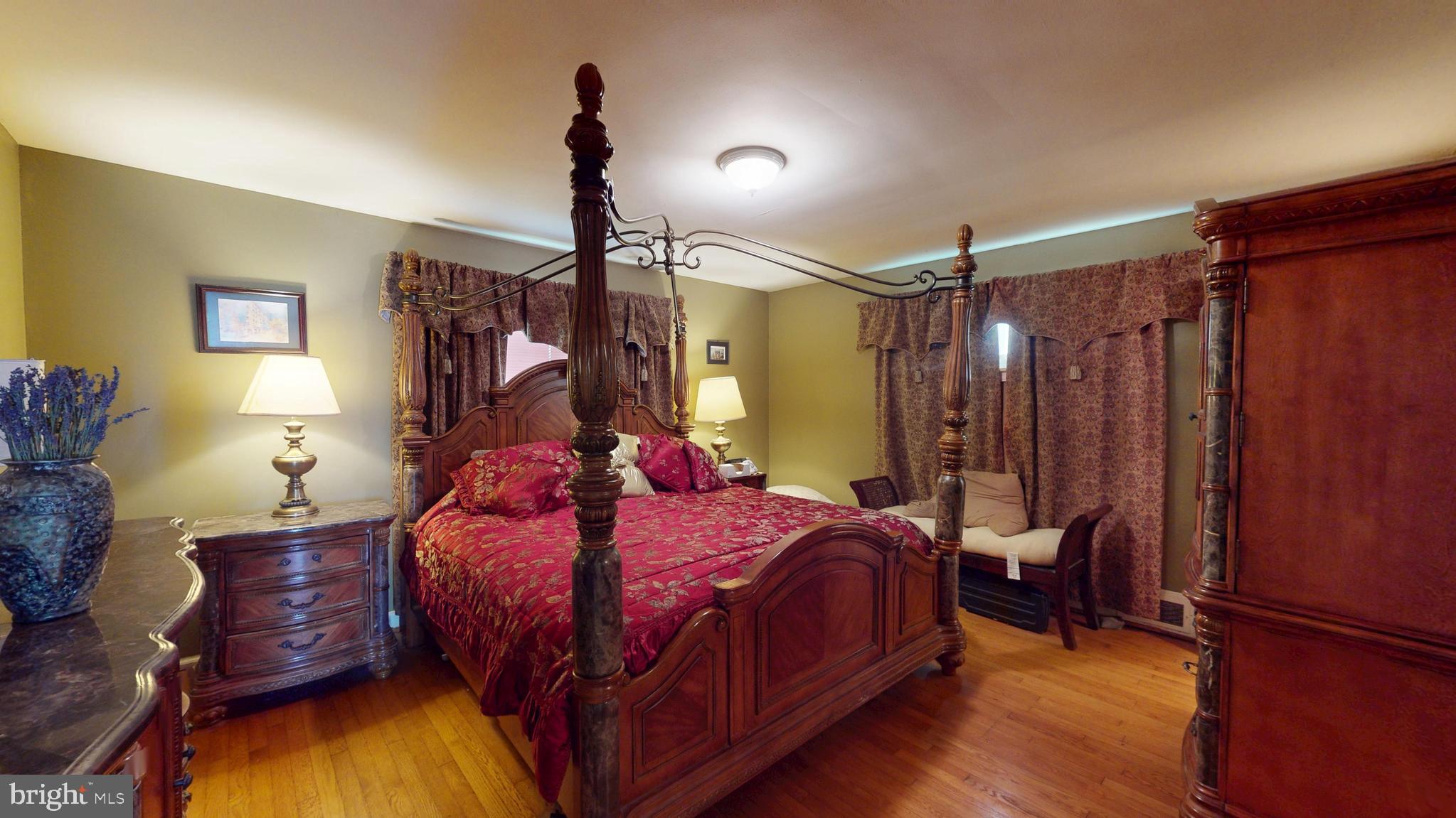 6103 Manor Road Clinton, MD 20735 - Photo 27 of 48 a bedroom with a bed window and a flat tv screen