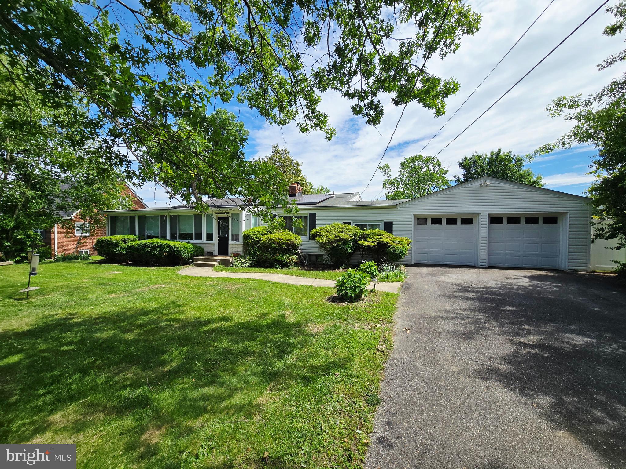 6103 Manor Road Clinton, MD 20735 - Photo 3 of 48 a front view of a house with a yard and trees
