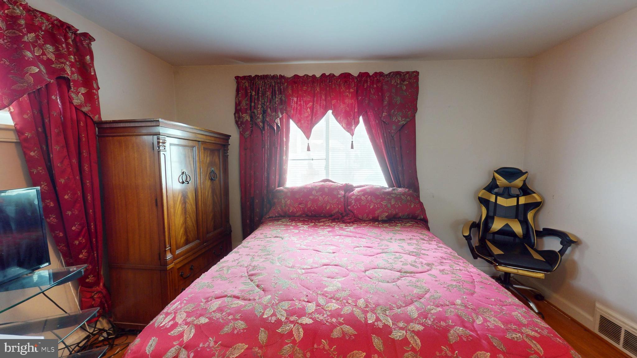 6103 Manor Road Clinton, MD 20735 - Photo 36 of 48 a bedroom with a bed and a window