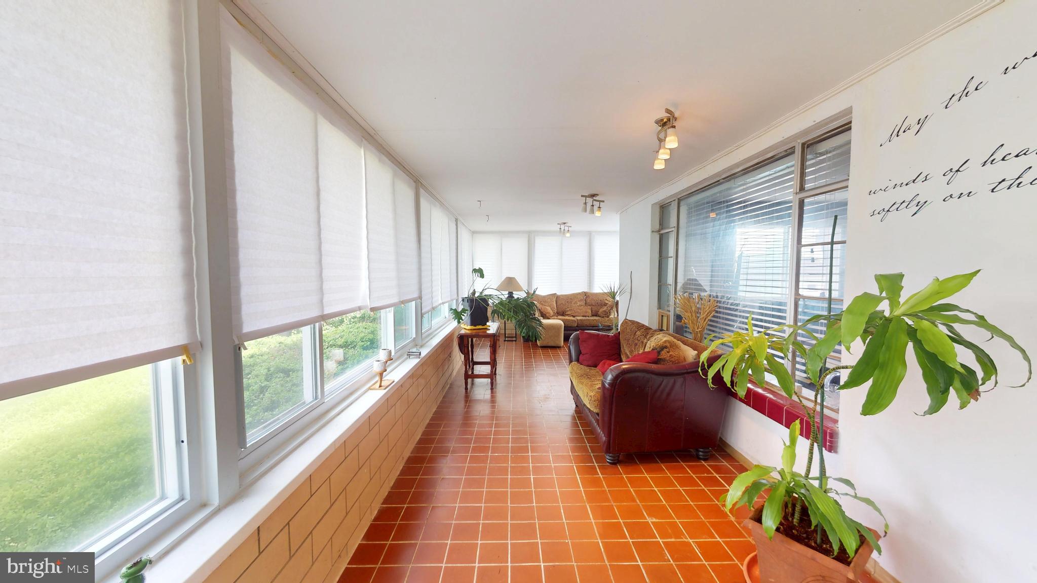 6103 Manor Road Clinton, MD 20735 - Photo 38 of 48 a living room filled with furniture and a potted plant