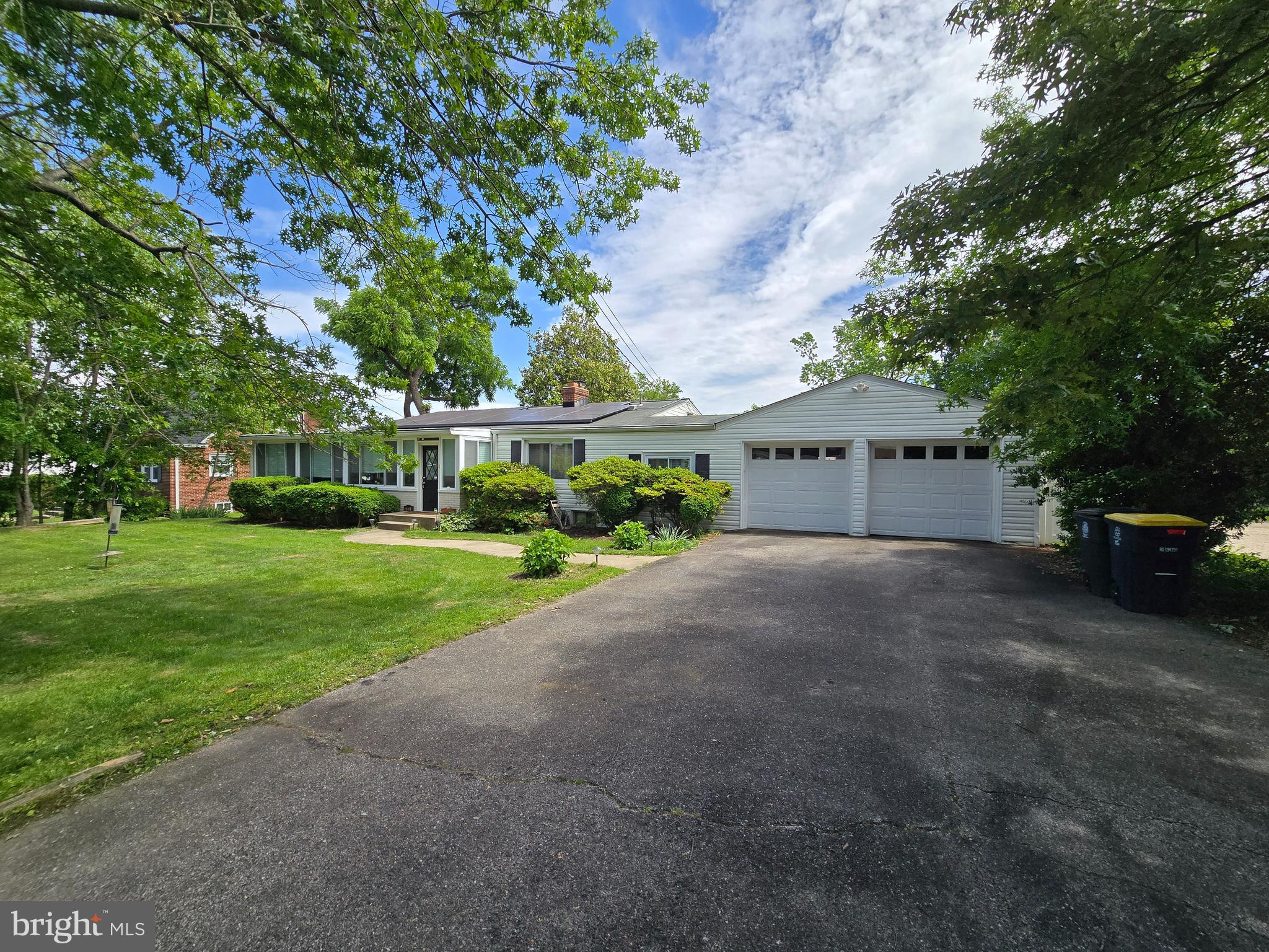 6103 Manor Road Clinton, MD 20735 - Photo 4 of 48 a view of a house with a yard and garage