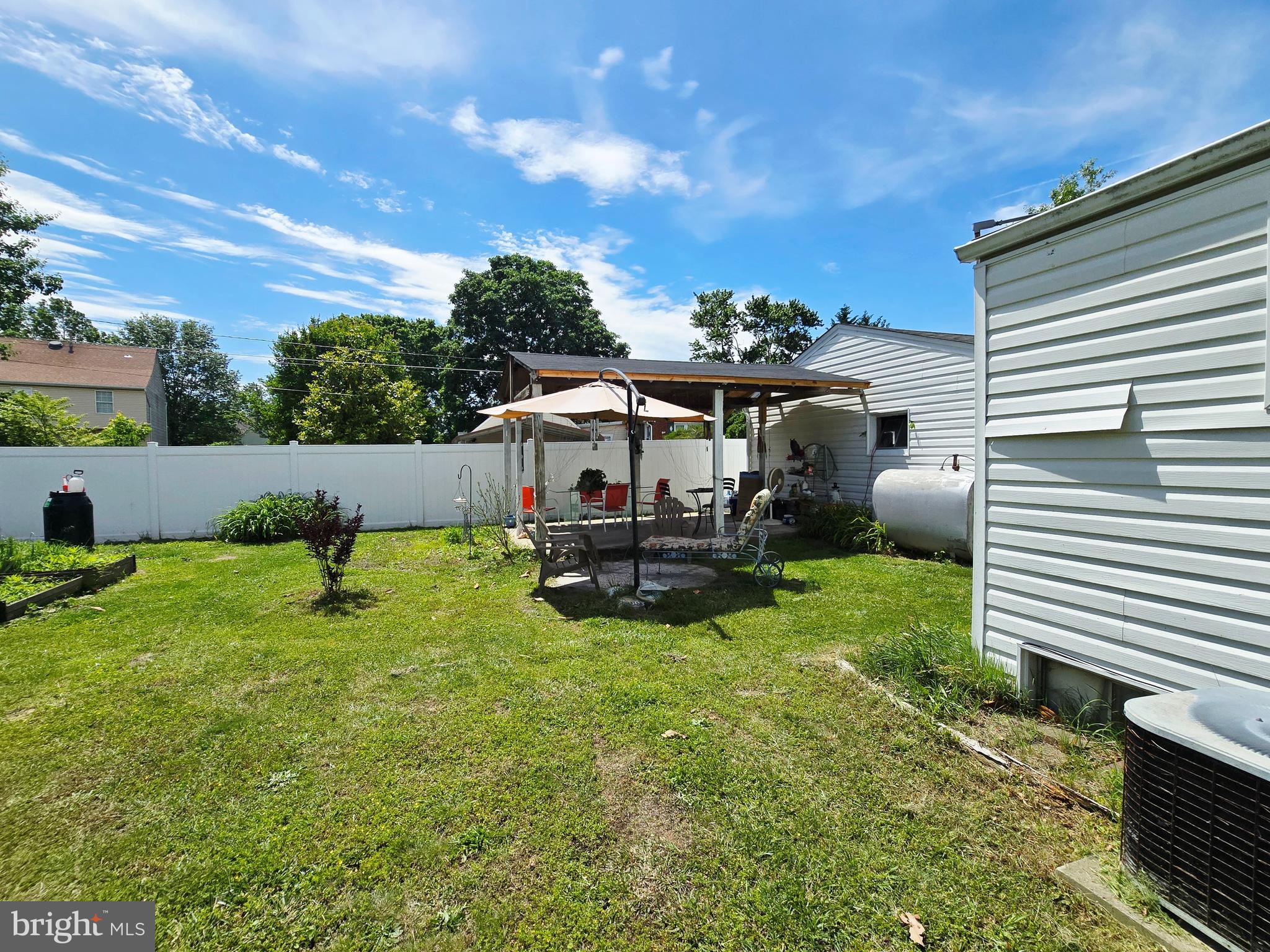 6103 Manor Road Clinton, MD 20735 - Photo 44 of 48 a view of backyard with seating area and green space