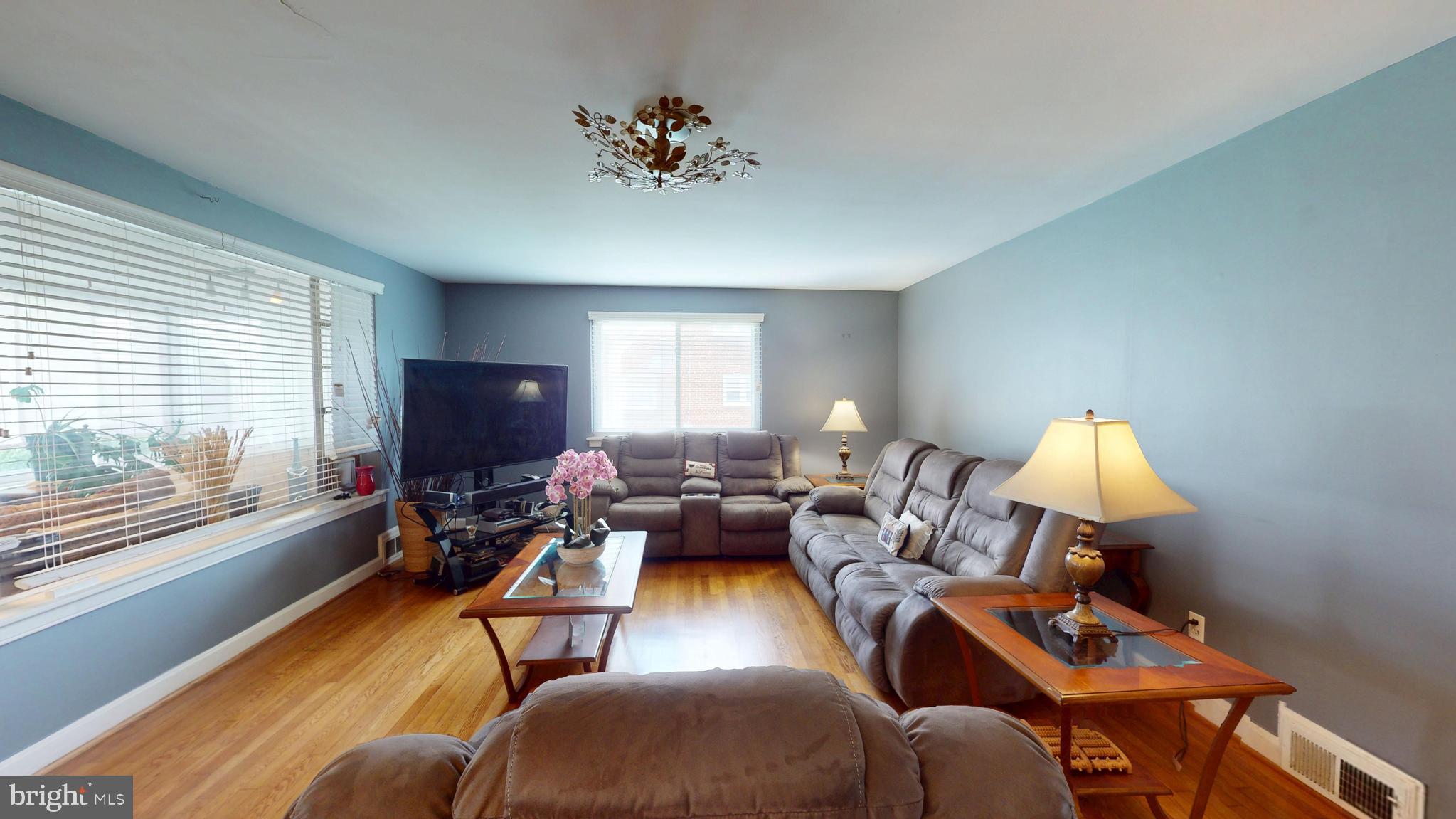 6103 Manor Road Clinton, MD 20735 - Photo 9 of 48 a living room with furniture and a flat screen tv