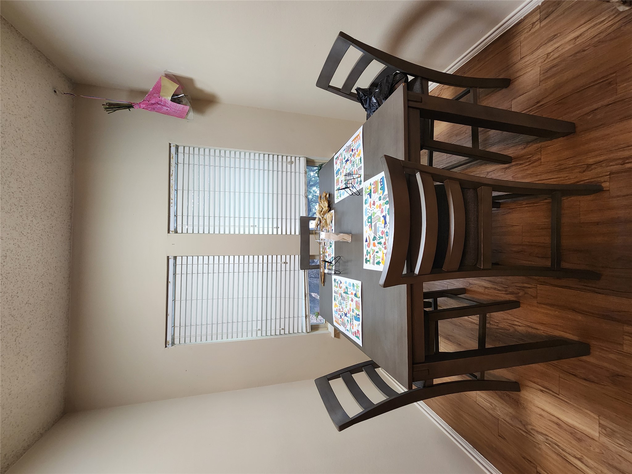 2414 Longview Street, Unit 306 Austin, TX 78705 - Photo 12 of 14 a view of a dining room with furniture and wooden floor
